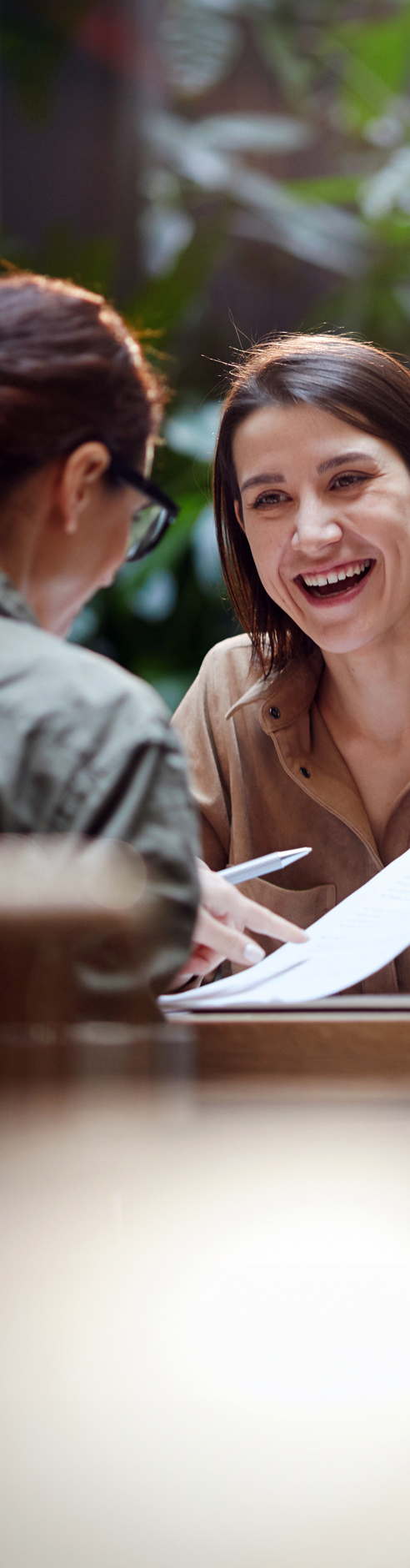 Laughing woman with papers