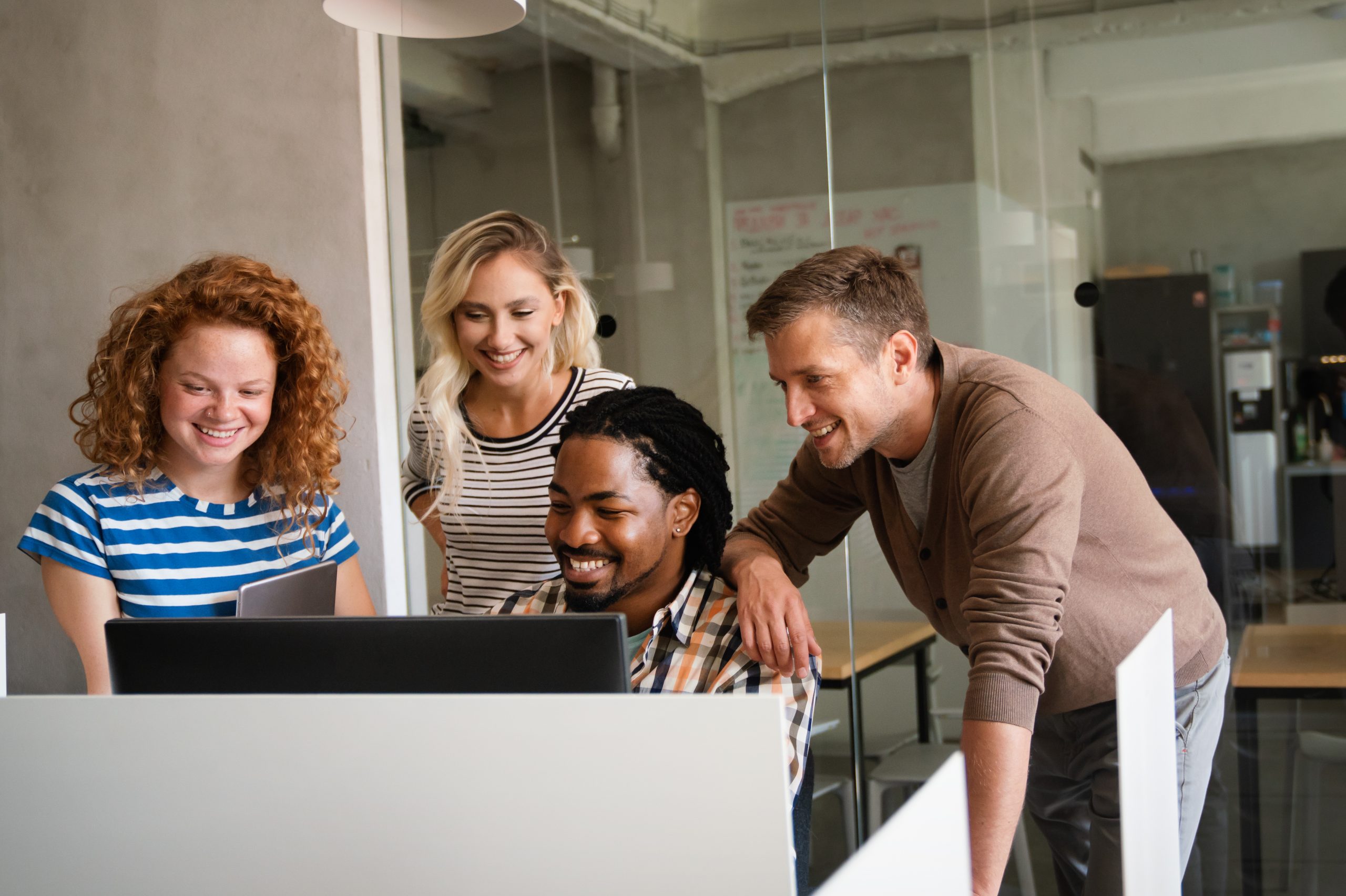 people in front of laptop